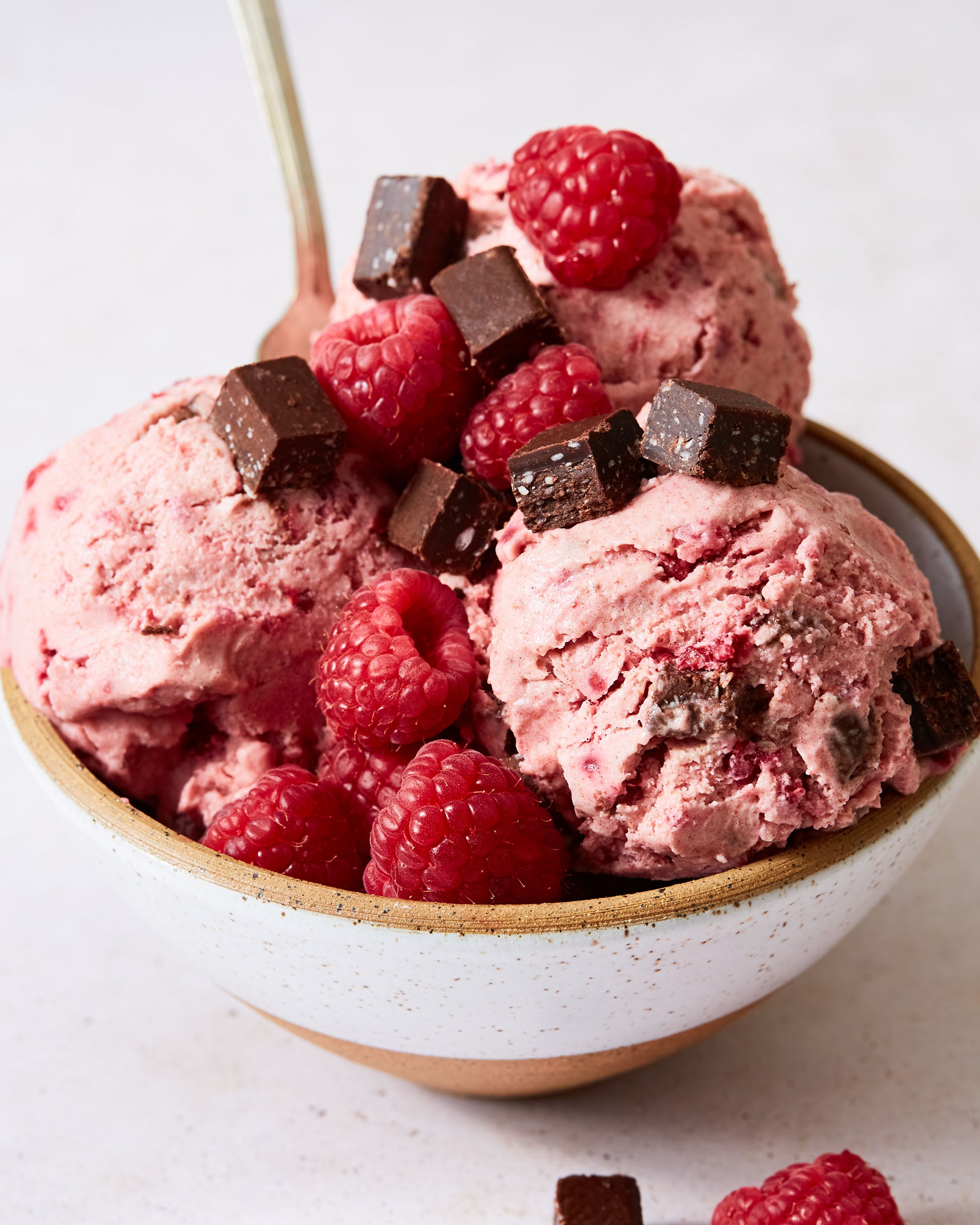 Raspberry coconut ice cream dairy-free with bright berry swirl for beautiful frozen dessert